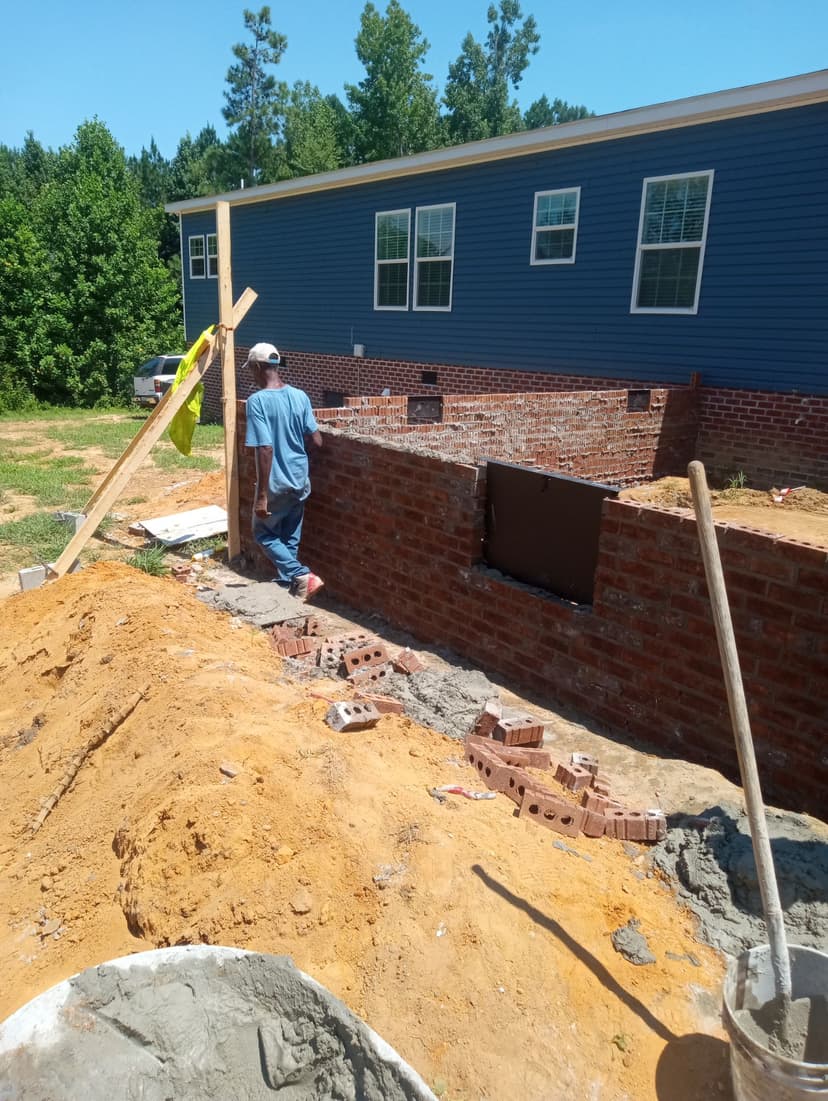 Brick masonry home foundation installation showing professional skills and quality materials