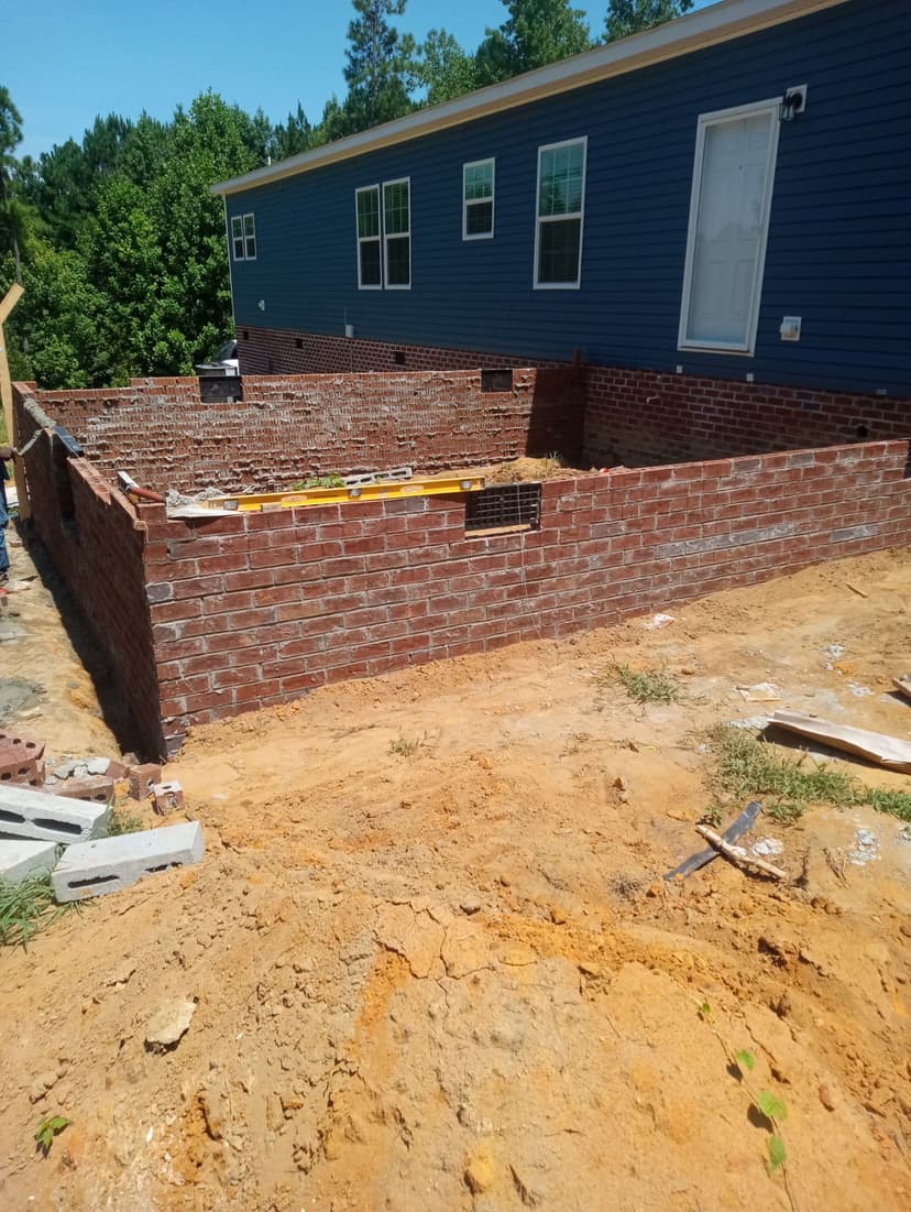 Foundation wall brick installation progress showing attention to detail and quality workmanship