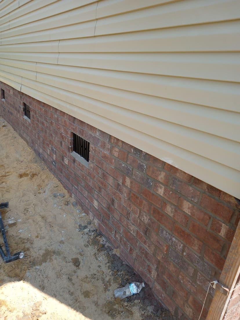 Professional brick skirt installation with precise craftsmanship and clean finish